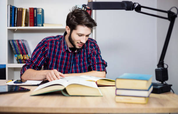College student reading a math book