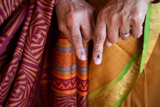 Woman showing finger after voting
