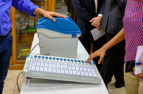 Polling personnel checking the AVM machine
