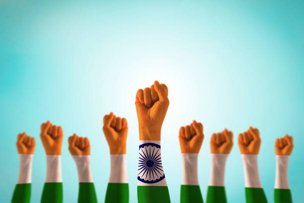 The flag symbol on the hands of the people with their fists clenched