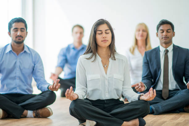 People are meditating in groups