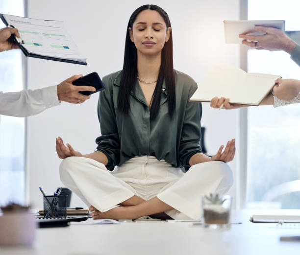 Working woman meditating in the office