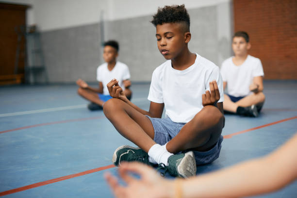 Young children are meditating at the meditation center
