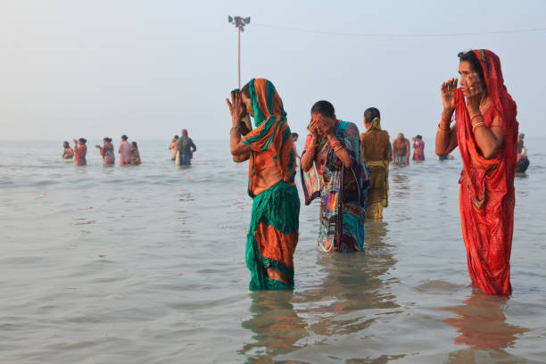 Women join hands in the Ganges by offering Arghya to Lord Surya