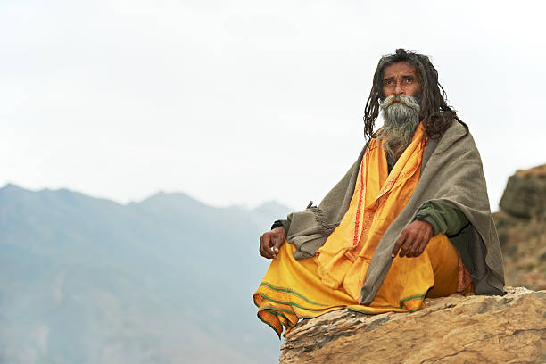 The spiritually rich monk meditating on the riverbank