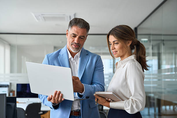 Describing the technology of business from a business laptop to a woman employee